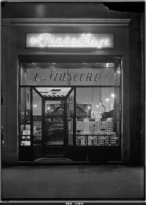 Krakowskie neony – 100 lat historii 3 Neon A. Piasecki, Kraków, Rynek Główny.